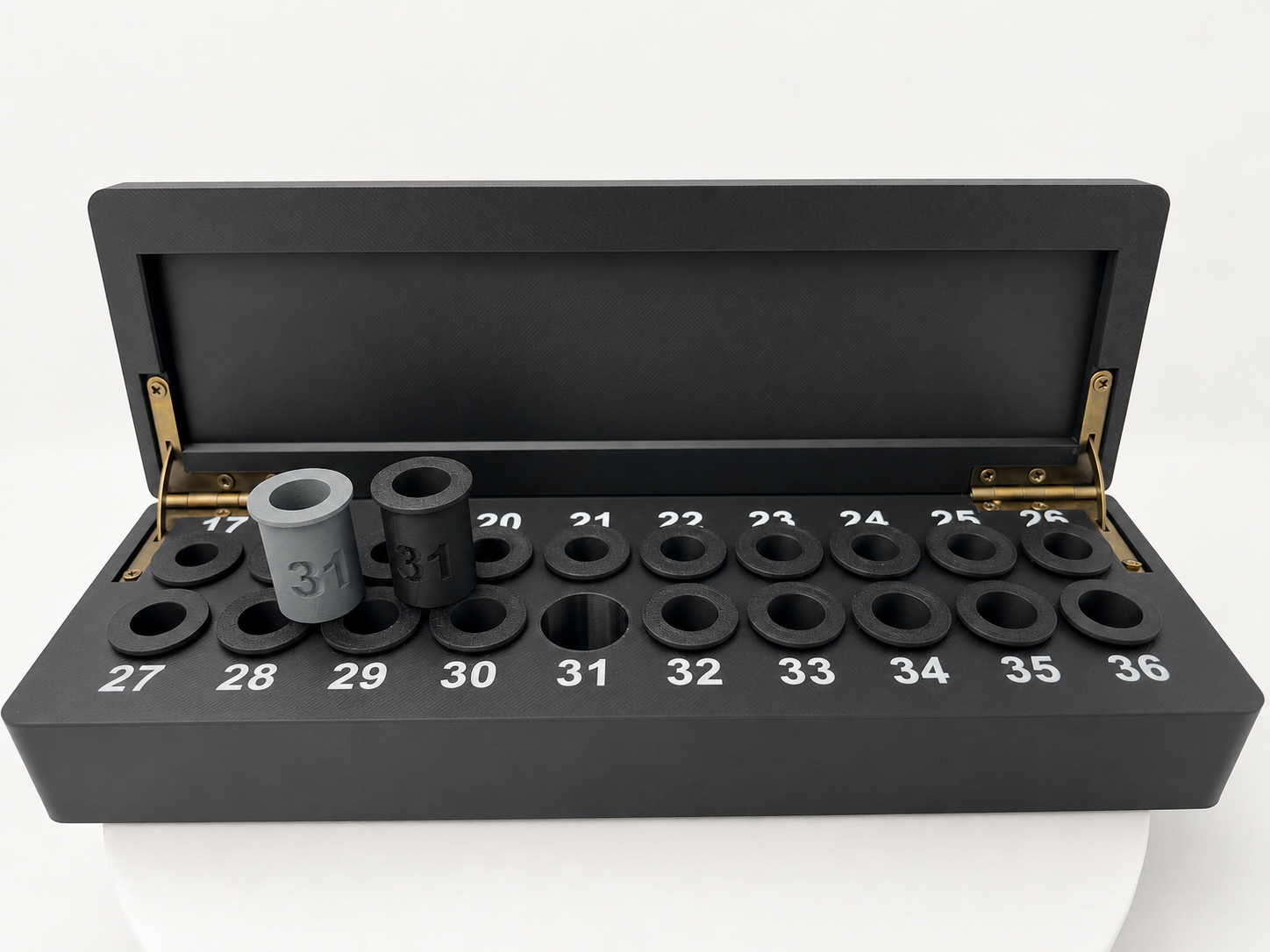 MEC-compatible bushing storage box showing numbered positions 17–36